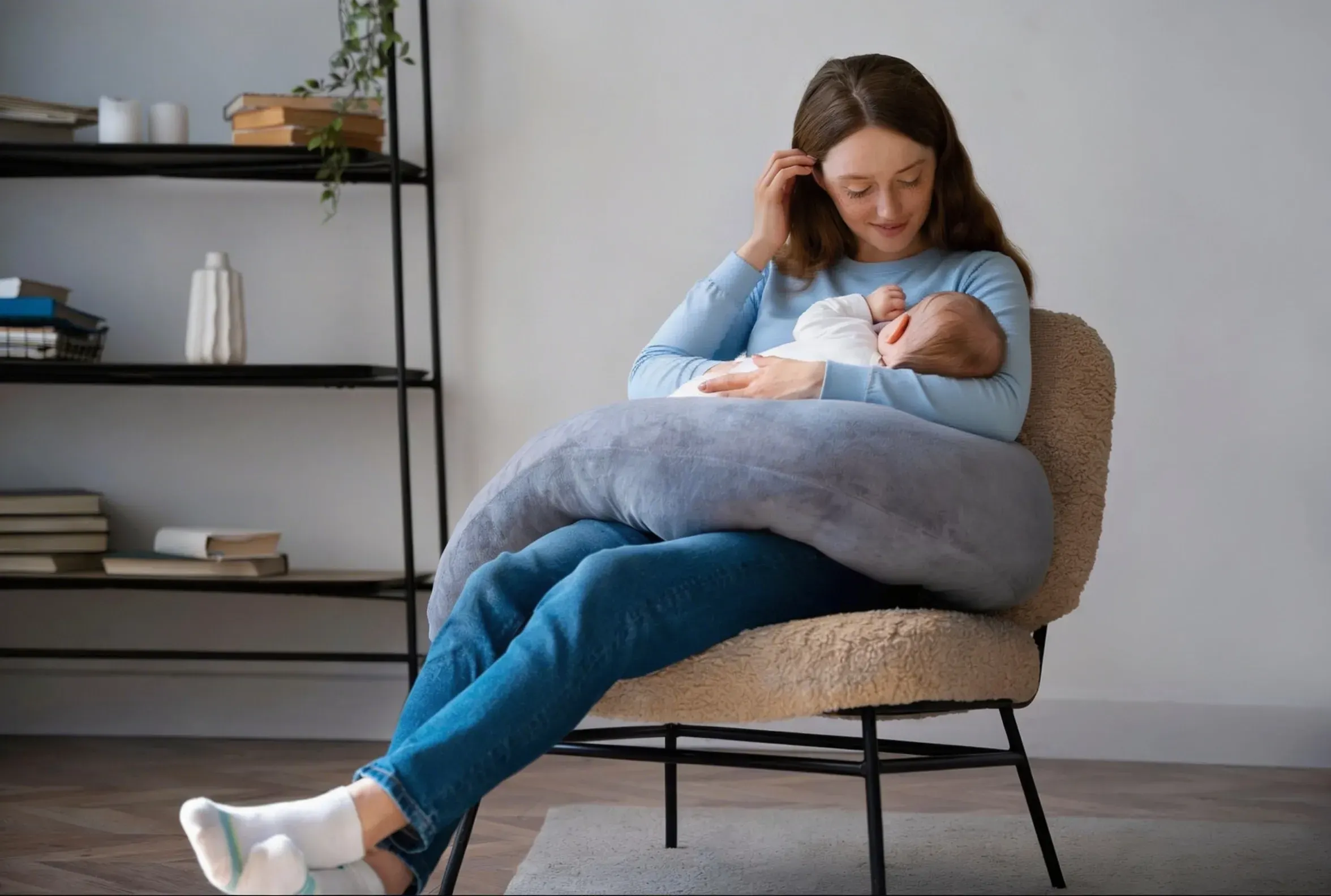 New mother receiving postpartum recovery care at Roots Chiropractic and Wellness Alma