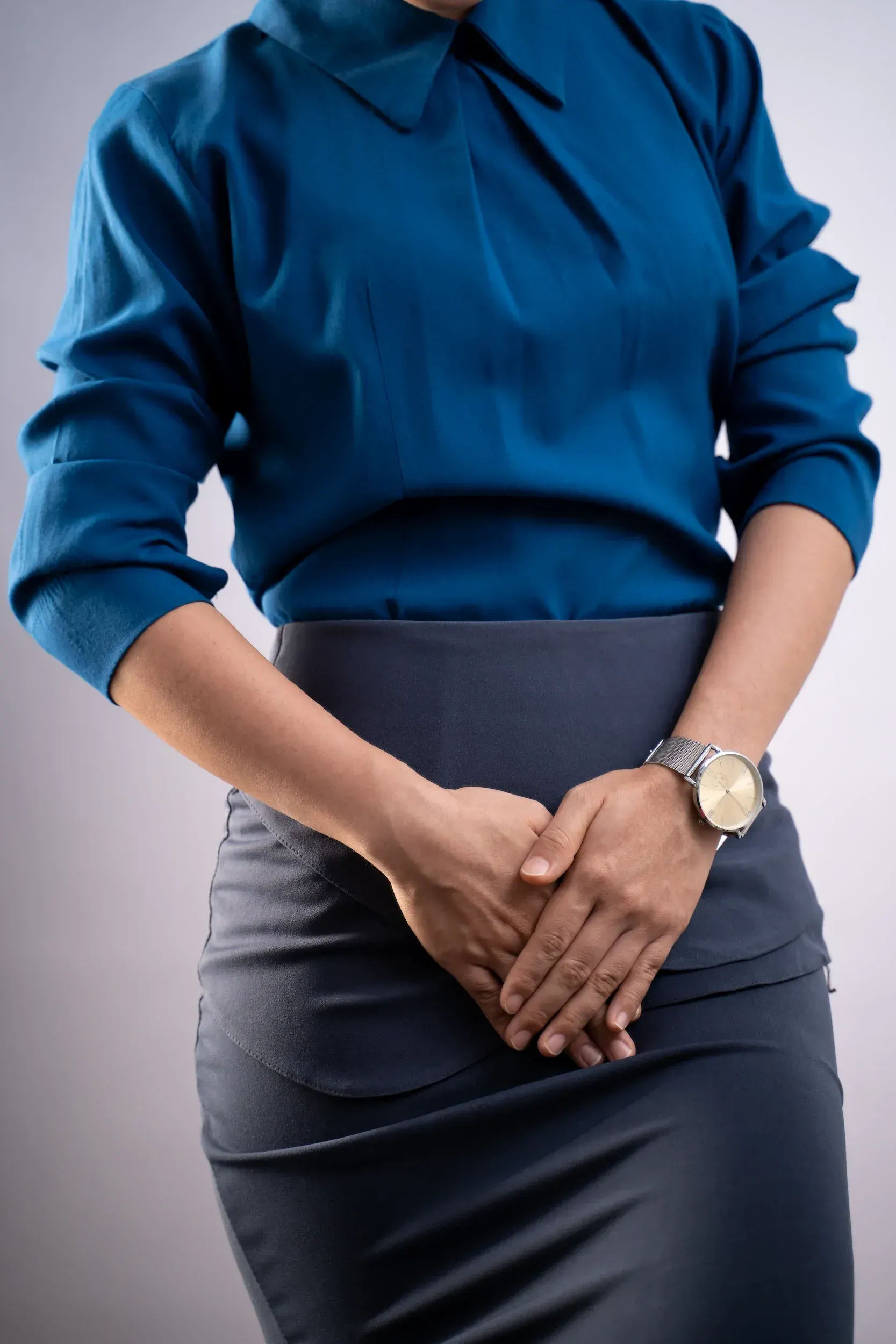 Woman considering pelvic health treatment at Roots Chiropractic and Wellness Alma