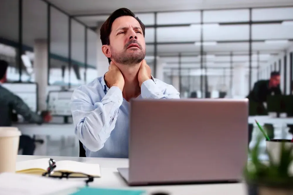 Specialist performing manual therapy for chronic neck pain relief in Alma, GA