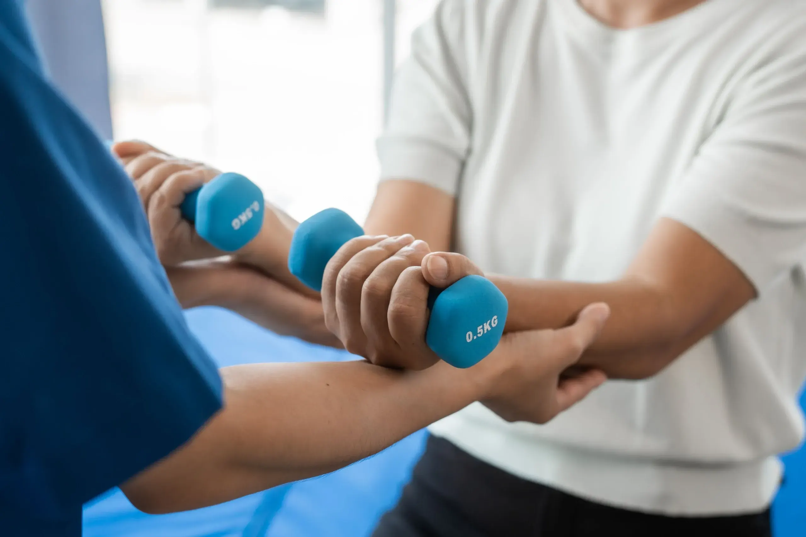 Sports chiropractor treating athletic injury at Roots Chiropractic in Alma, GA